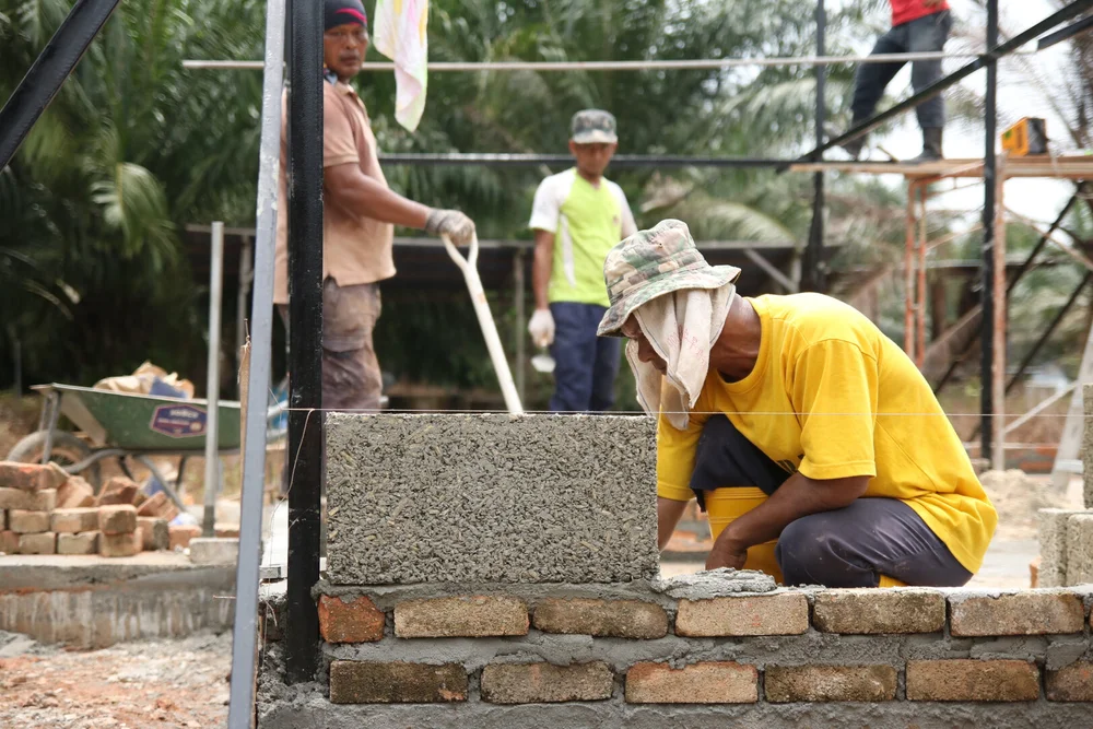 Working together to build houses representing stewardship and community